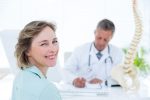 39828480 – patient smiling at camera in medical office